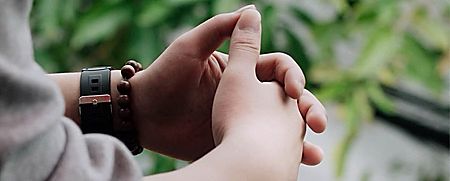 Close-up of a person's clasped hands